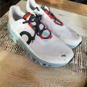 On Running White Sneakers with Black and Red Details